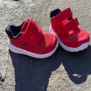Nike Toddler Star Runner, red and black. Size 2C. Velcro straps.
